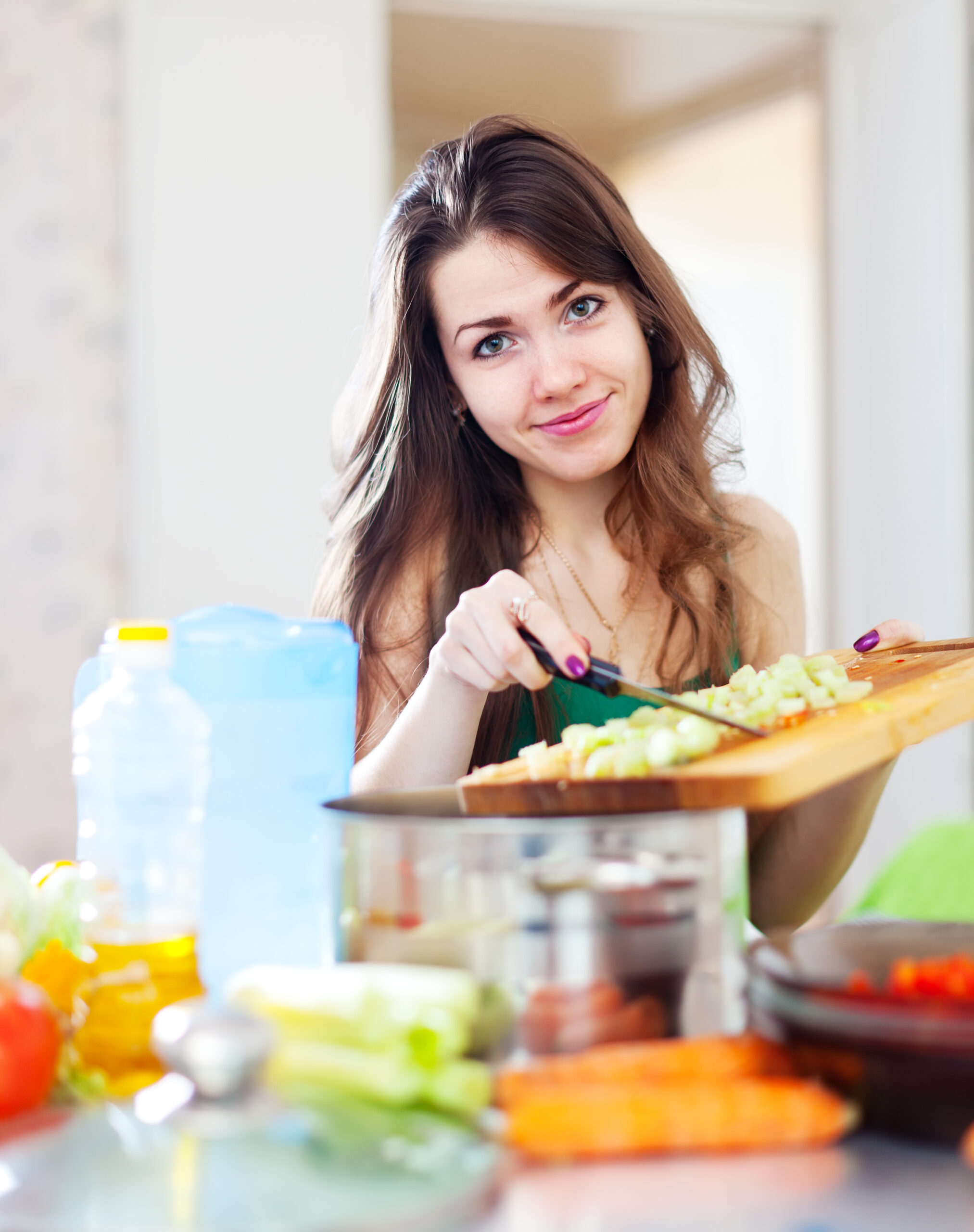 Woman chopping fresh vegetables | Holistic Menus