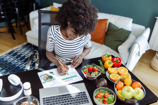 Nutritionist planning healthy diet plan | Holistic Menus
