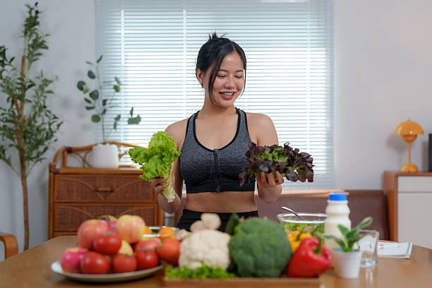 Fit woman choosing fresh greens | Holistic Menus