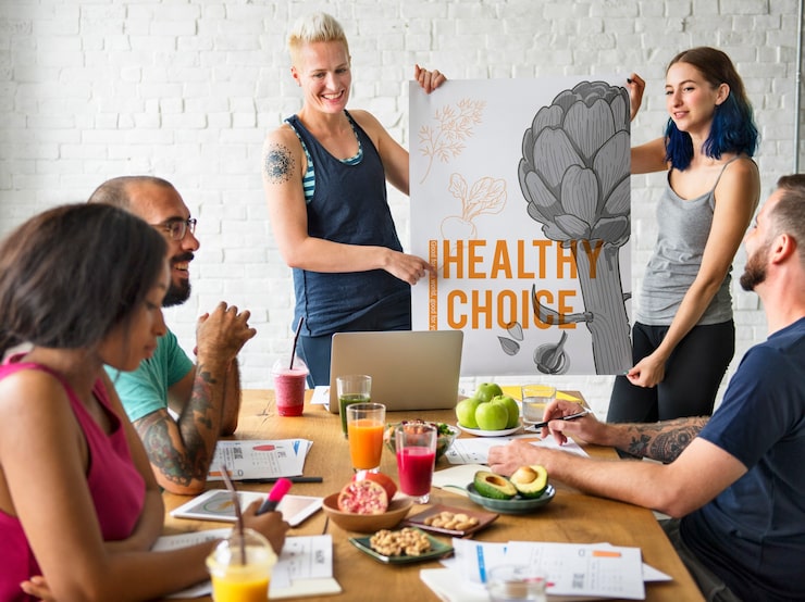 Group presenting a healthy poster | Holistic Menus