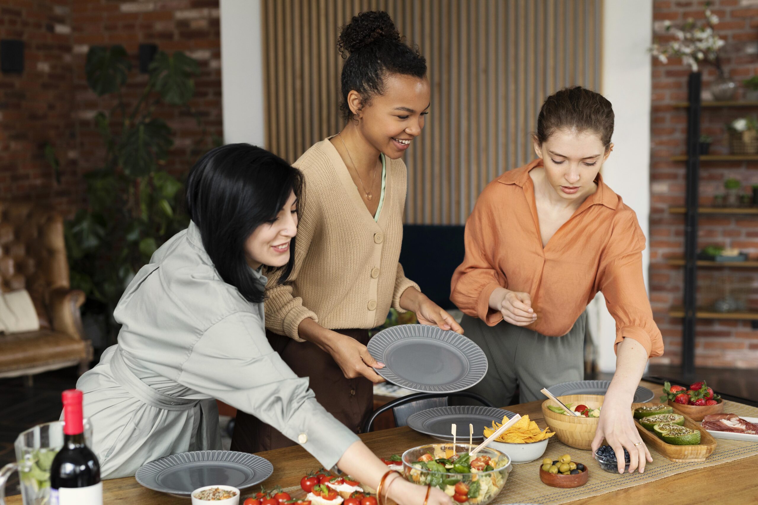 Friends sharing dinner party | Holistic Menus