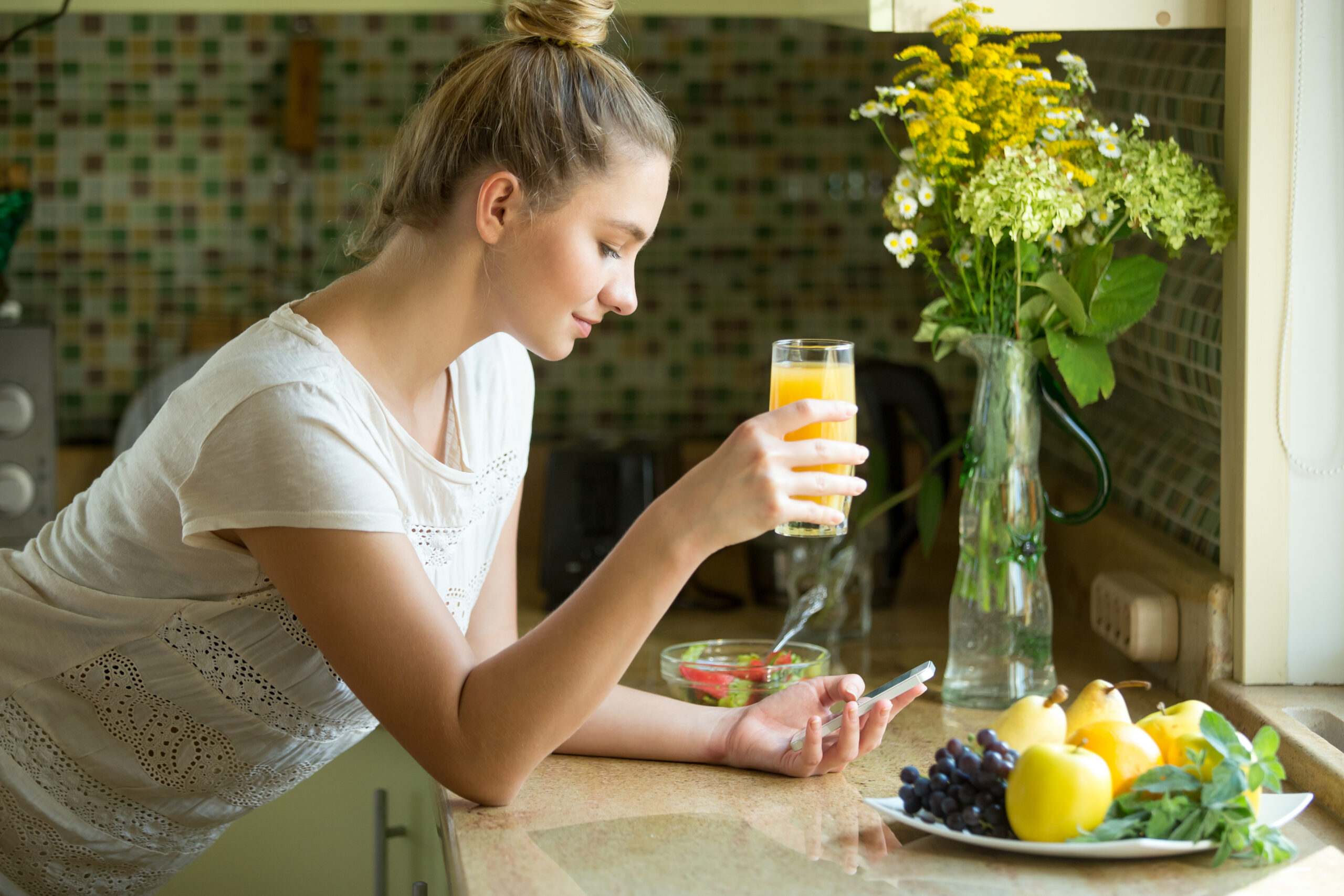 Woman enjoying healthy juice | Holistic Menus