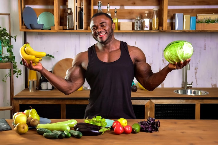 Fit man holding fresh produce | Holistic Menus